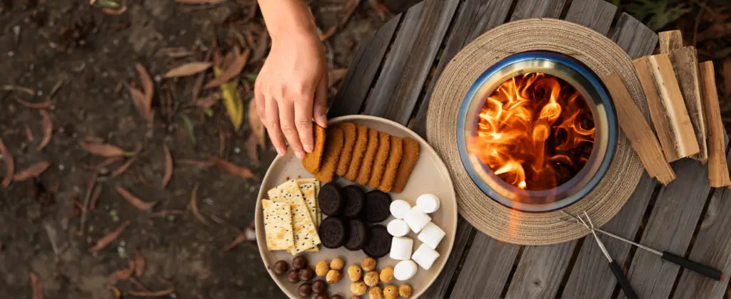 cookies and marshmallows in a dish, next to our tabletop fire pit.